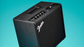A Fender Mustang LT25 on a blue background