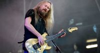 Jerry Cantrell of Alice In Chains plays his iconic "Blue Dress" G&L Rampage onstage in Australia in 2009. Bought in 1985, its eponymous graphic has been worn away after decades of use.